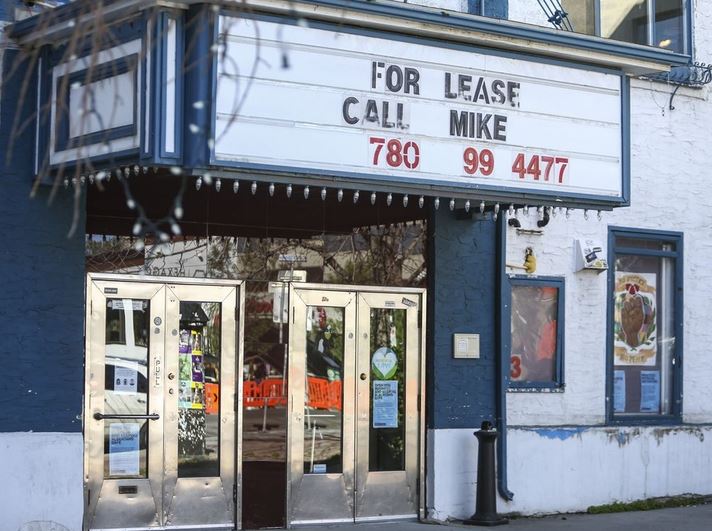 Calgary Plaza Theatre front door area with for lease sign