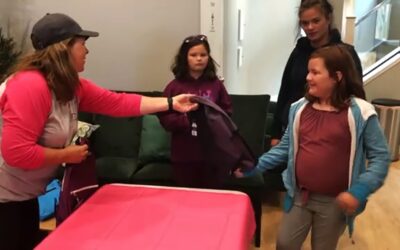 Owen Hart Foundation gives away hundreds of backpacks to children in need